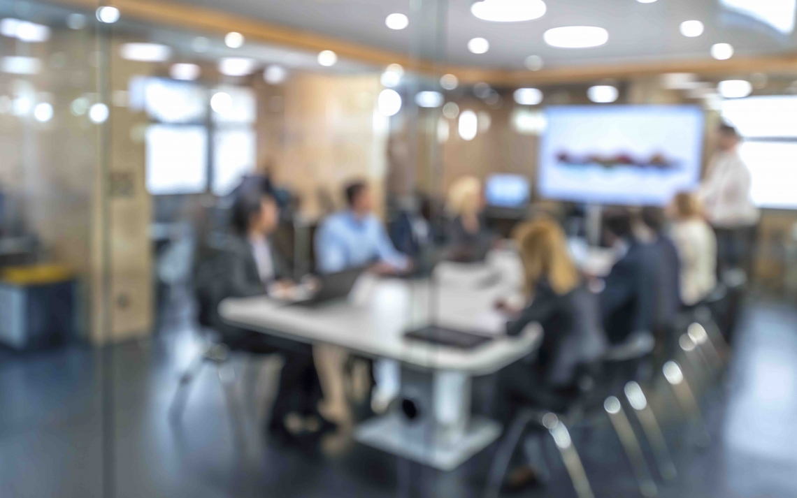 business people sitting in conference room