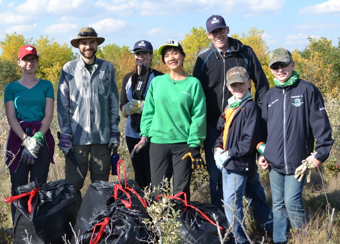 Group of employees volunteering with a nature organization